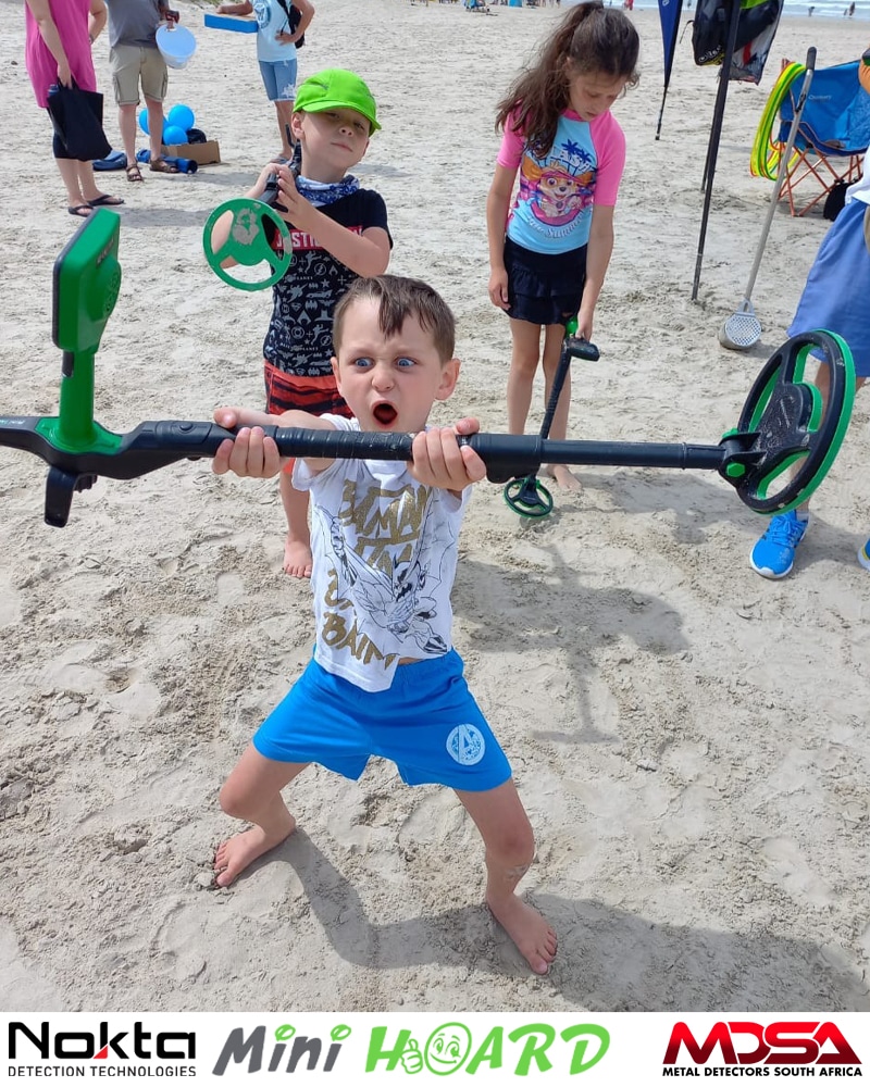 Enthusiastic look of youngster hold Nokta Midi Hoard Kids Metal Detector