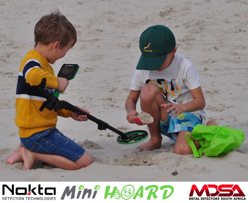 Young brothers metal detecting on the beach with the Nokta Midi Hoard Kids Metal Detector